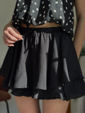 short noir fluide avec noeud