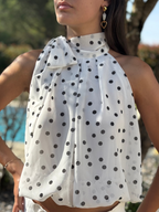 top blanc à pois noirs avec noeud sur le coté